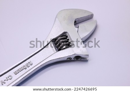 A wrench or spanner is a tool used to provide grip and mechanical advantage in applying torque to turn objects—usually rotary fasteners, such as nuts and bolts
