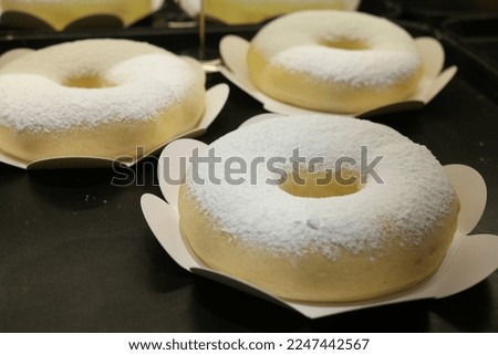 Cream cheese donuts sprinkled with white sugar
