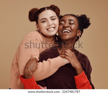 Lesbian, couple hug with young women and happy with fashion and marketing, love and fun together against studio background. Lgbtq community, gen z and freedom with style and lgbt people with pride Royalty-Free Stock Photo #2247481787