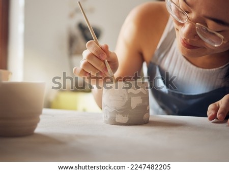 Woman, pottery studio and painting workshop for sculpture product, creative manufacturing and design startup. Painter, ceramics and brush process, artistic pattern and production in small business Royalty-Free Stock Photo #2247482205