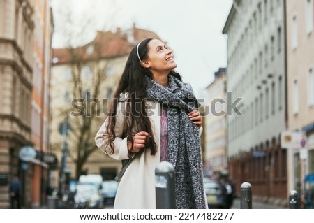 Walking, city buildings and woman travel on urban street, road or on holiday adventure journey In Chicago Illinois. Outdoor wanderlust, sidewalk and girl on tour journey of USA for winter vacation Royalty-Free Stock Photo #2247482277