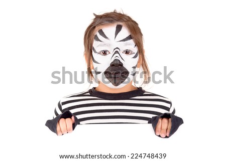 little girl with face painted as a zebra isolated in white