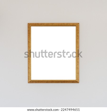 Empty picture frame with mockup copy space hanging on the wall, square format
