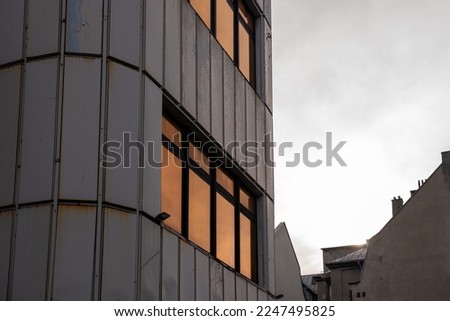 Detail of modernistic building - 
headquarters of "Katowice Miasto Ogrodow" cultural institution. Rounded corner and facade made of white, steel panels. 