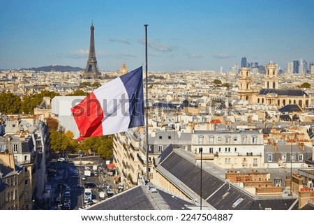 Scenic Parisian cityscape. Aerial view of the Eiffel tower over the French flag in Paris, France Royalty-Free Stock Photo #2247504887