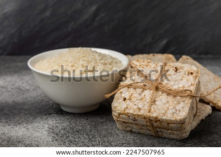 Stack of crispy rice cakes on black textured background. Diet bread. Diet. proper nutrition. GLUTEN FREE. Copy space. Place for text.