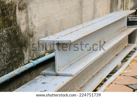 H-Beam on the ground against the wall