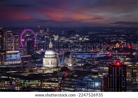 Elevated view of the skyline of London with St. Pauls Cathedral, river Thames and Big Ben tower in the background