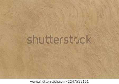 Old traditional house wall texture in Shindaga, Dubai. Brown beige sandy color rough plaster background. Royalty-Free Stock Photo #2247533151