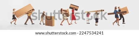 Group of young happy people in vintage clothes carrying big cardboard boxes isolated over white studio background. Black Friday, sales, shopping, moving, real estate concept. Collage