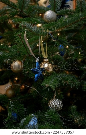 Decorated Christmas tree close-up. Christmas trunks macro photo with bokeh. winter holiday light decoration