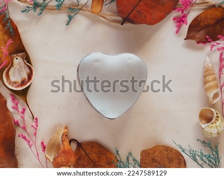 Heart box on white sheet and dried flowers decorated for valentine
