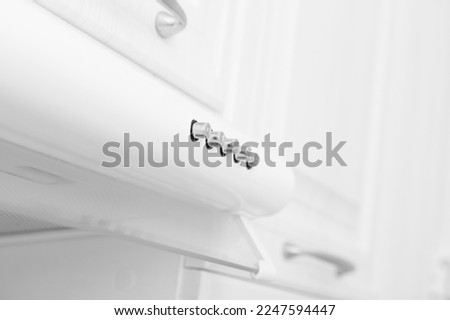 Abstract white background with extractor hood in modern kitchen