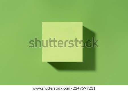 Green scene for product presentation, green stage flat lay made with square shape. Studio photography.