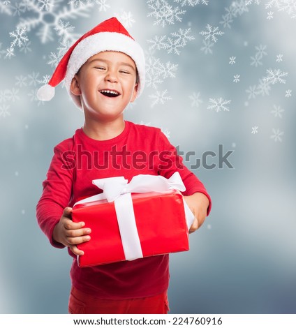 portrait of a happy little boy holding a new gift