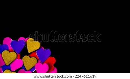 colorful hearts on black background for valentine's day