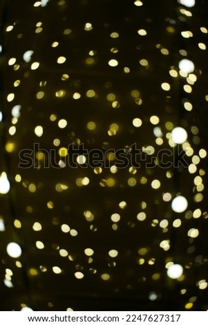 Abstract bright background, bokeh of burning yellow light bulbs