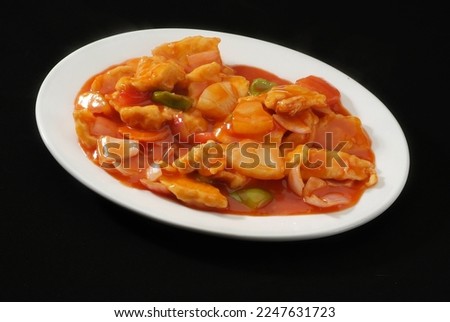 Sweet and sour chicken, Is a popular Indo-Chinese delicacy all over India. Battered sea food, Chinese cuisine pictures, isolated on Black background.