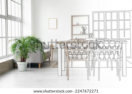 New interior of light dining room with table, wicker chairs and sofa with houseplant