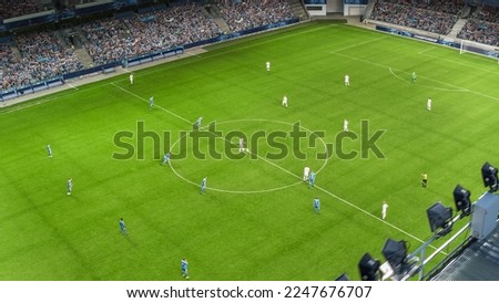 Soccer Championship Match on a Stadium full of Cheering Fans. Teams Play on Major League Football Tournament, Cup Broadcast. Sport Channel Television, Screen Content Concept. Aerial Drone Shot. Royalty-Free Stock Photo #2247676707