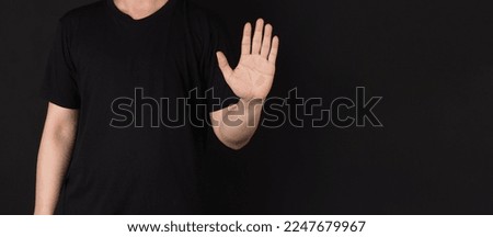 The single wave hand sign on black background.