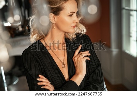 Romantic portrait of a girl dressed in an elegant dress and expensive jewelry Royalty-Free Stock Photo #2247687755
