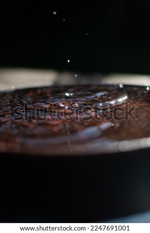 Drops of water in a plate