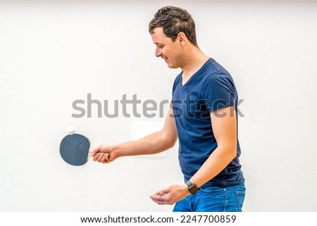 man plays table tennis. copy space