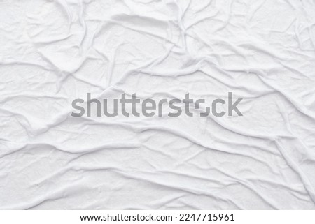 Texture of crumpled wet white paper with folds. writing paper