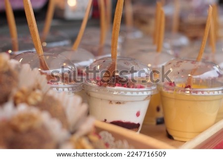 Pastry shop, cafe. Desserts and Cupcakes stock photo. Rustic wood background. Christmas market. Take away food