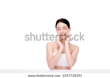 Attractive beauty young asian woman clean skin with cotton pad removing make up on white background. Royalty-Free Stock Photo #2247728391
