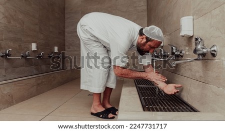 A Muslim performing ablution. Ritual religious cleansing of Muslims before performing prayer. The process of cleansing the body before prayer