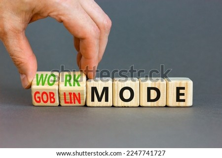 Work or goblin mode symbol. Concept word Work mode Goblin mode on wooden cubes. Businessman hand. Beautiful grey table grey background. Business work or goblin mode concept. Copy space. Royalty-Free Stock Photo #2247741727