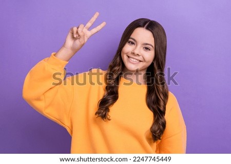Photo of positive lovely person arm fingers demonstrate v-sign isolated on violet color background