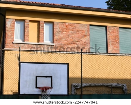 old hoop in a prison reformatory basketball court with no people Royalty-Free Stock Photo #2247747841