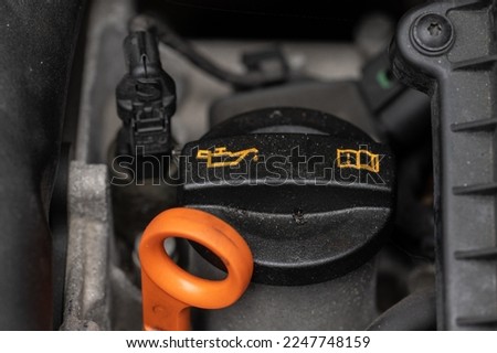 Oil filler cap on a car engine. Royalty-Free Stock Photo #2247748159