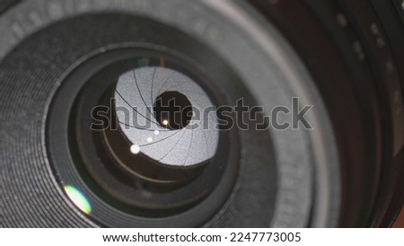 Cinema lens iris aperture blades opening Royalty-Free Stock Photo #2247773005