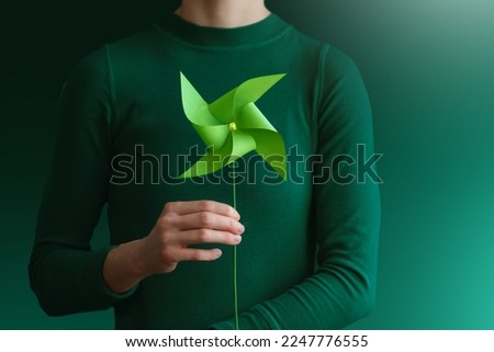 ESG and Clean Energy Concept. Close-up of Wind Turbine Paper. Decrease Carbon and Produce a Green Power. World Earth Day, Sustainable Resources, Environmental and Ecology Care Royalty-Free Stock Photo #2247776555
