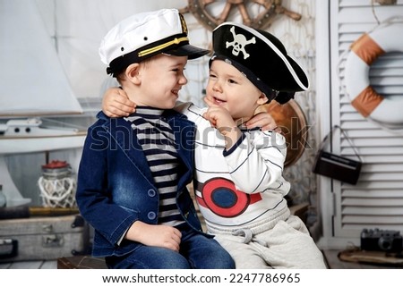 Children's games. Two cute boys play pirates, they have fun and interesting together.