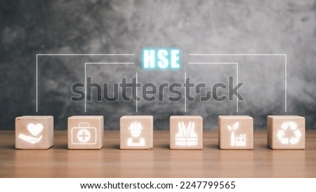 Health safety environment HSE education industry Concept, Wooden cube block with Health safety environment icon  on virtual screen.