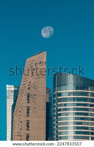Set of skyscrapers in Reforma Av with a waning moon in Mexico City. Royalty-Free Stock Photo #2247833507