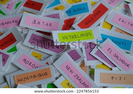 Random country name on colorful paper
