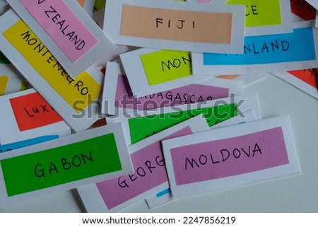 Random country name on colorful paper