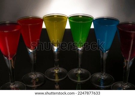 Dark black background with color fresh glass shots