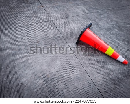 Traffic cone fall on concrete surface