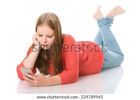 Young girl with cellphone islolated on white