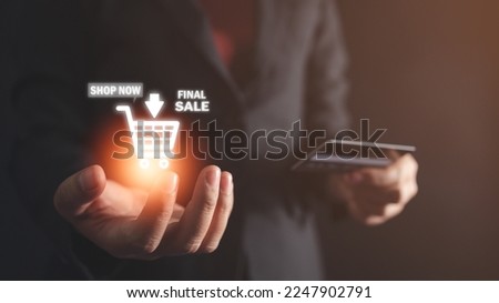 Businesswoman holding an icon showing online shopping, internet shopping, connecting buyers and sellers, visual screen.