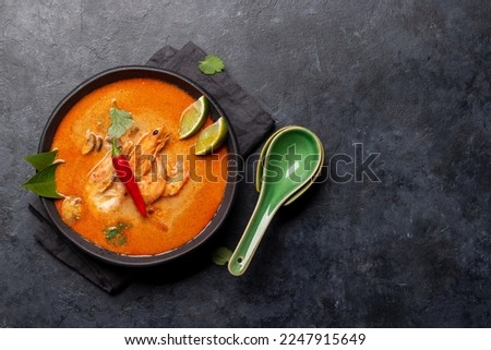 Thai Tom Yum Soup with seafood. Flat lay with copy space Royalty-Free Stock Photo #2247915649