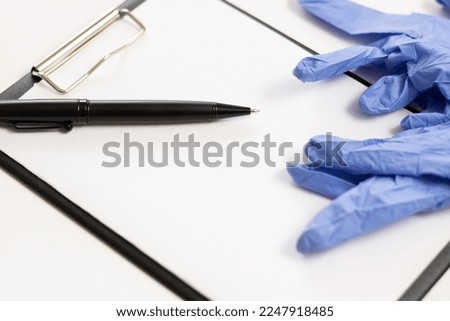 Close-up space for text, medical gloves, ballpoint pen, document. medical document.e.