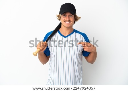 Young blonde man isolated on white background playing baseball and with surprise facial expression